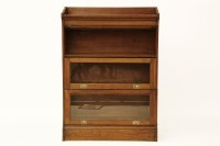 Lot 1762 - An early 20th century three tier sectional Globe Wernicke style bookcase