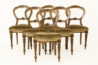 Lot 600 - A set of six late Victorian mahogany balloon back dining chairs with stuffover seats on fluted turned supports (6)