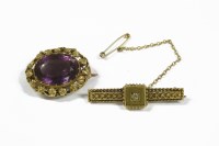 Lot 26 - A gold single stone diamond bar brooch marked 15ct