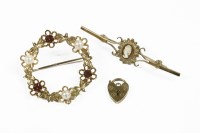 Lot 2 - A 9ct gold circular floral brooch