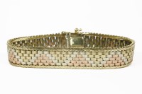 Lot 24 - A 9ct three colour gold brick line with feathered link edge bracelet