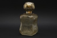 Lot 150 - A white metal topped perfume bottle