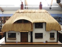 Lot 713 - A doll's house and contents
