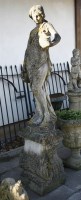 Lot 896 - A reconstituted stone figure of a maiden in Grecian dress carrying amphora