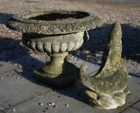 Lot 898 - A reconstituted stone garden urn on stand
