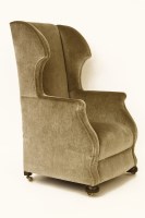 Lot 810 - An early 20th century Georgian style wing back armchair