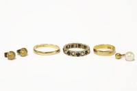 Lot 210 - A 9ct gold garnet and seed pearl eternity ring
