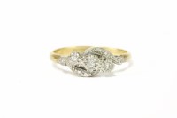 Lot 226 - A gold three stone diamond cross over ring