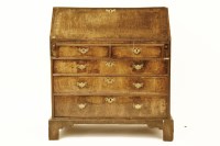 Lot 853 - A walnut and feather banded bureau