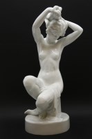 Lot 624 - A large Herend white figure of a girl sitting adjusting her hair
