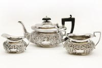 Lot 393 - A small embossed silver three piece tea set
