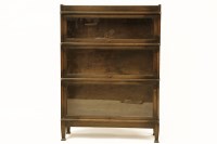 Lot 776 - A Globe Wernicke three section oak bookcase on separate base