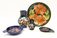 Lot 588 - A Moorcroft plate hibiscus green ground