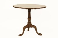 Lot 766 - A George III mahogany tilt top tea table