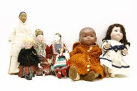 Lot 562 - An assortment of dolls