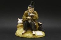 Lot 438A - A 20th century Russian porcelain figure of a tramp sat barefoot upon a grassy stump