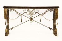 Lot 882 - A wrought iron and faux marble topped console table