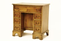 Lot 773 - A George I design yew wood kneehole desk