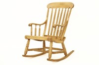Lot 883 - A beechwood bobbin turned rocking chair