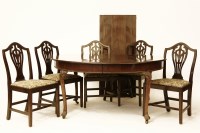 Lot 894 - An oval French polished mahogany extending dining table