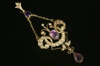 Lot 668 - An Edwardian amethyst and split pearl pendant/brooch