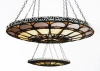 Lot 149 - A pair of coloured glass and repoussé brass large dish lights