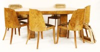 Lot 127 - An Art Deco burr walnut dining room suite