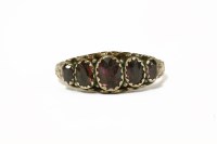 Lot 13 - A 9ct gold graduated five stone oval cut garnet ring