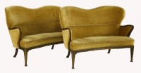 Lot 243 - A pair of Danish stained beech settees
