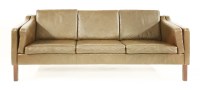 Lot 354 - A Danish brown leather three-seater settee
