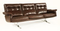 Lot 339 - A Danish brown leather three-seater settee