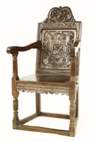 Lot 541 - An oak armchair