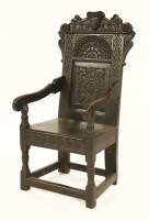 Lot 546 - An oak wainscot armchair