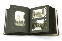Lot 93A - A large album of topographical postcards