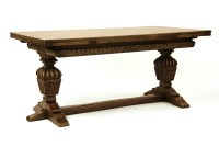 Lot 467 - A 20th century oak dining suite