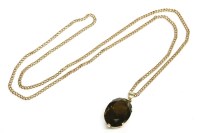 Lot 17 - An oval cut smokey quartz pendant