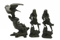 Lot 180 - A Japanese spelter figure of an eagle perched on a tree trunk