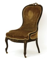 Lot 473 - A Victorian ebonised and gilt metal mounted ladies chair