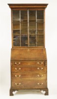 Lot 410 - A George III mahogany bureau bookcase