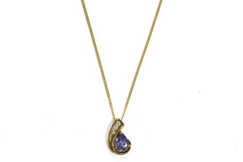 Lot 7 - A 9ct gold pear shaped tanzanite and brilliant cut diamond pendant
