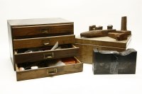 Lot 243 - A four drawer table top cabinet