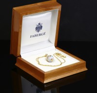 Lot 383 - An 18ct gold contemporary enamelled egg pendant and chain