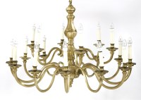 Lot 101 - A pair of Dutch-style brass eighteen-branch electroliers