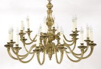 Lot 199 - A pair of Dutch-style brass eighteen-branch electroliers