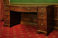Lot 460 - A George III mahogany serpentine sideboard