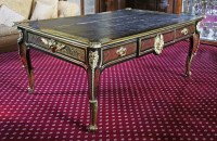 Lot 390 - An impressive Louis XV-style ebony and red boulle bureau plat