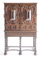 Lot 478 - A Continental oak two-door chest on stand