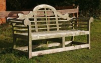 Lot 556 - A teak garden seat