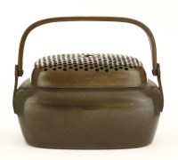 Lot 1219 - A Chinese bronze hand warmer