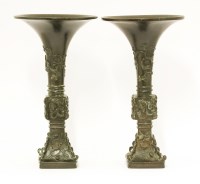 Lot 1223 - A pair of Chinese bronze gu vases